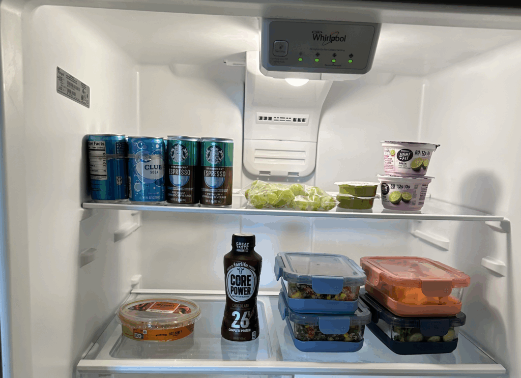 Picture of refrigerator stocked with yogurt, drinks, fruits and vegetables for a small business owner quarterly planning retreat.
